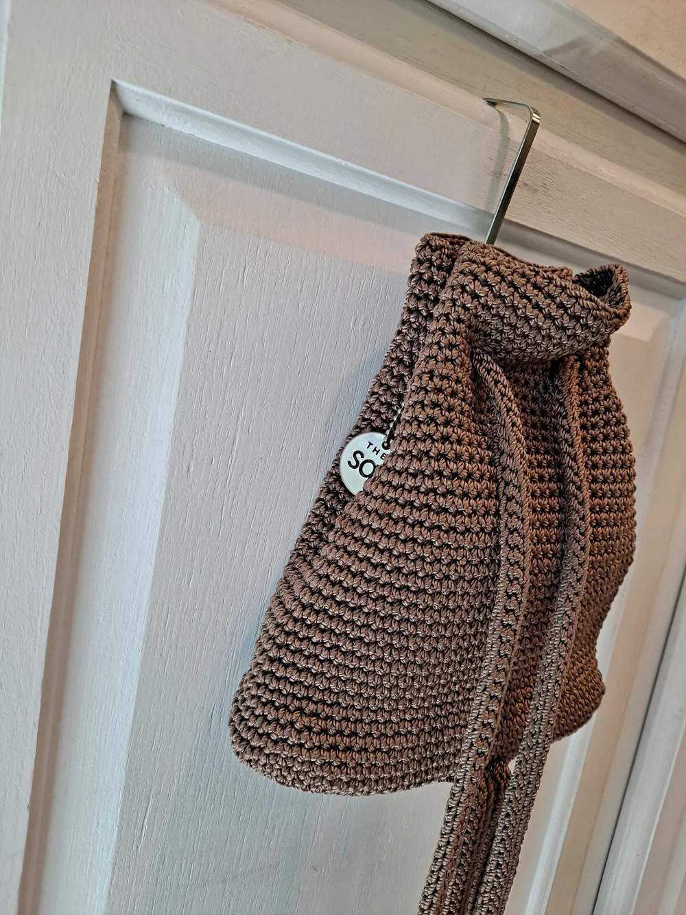 The Sak Brown Crochet Drawstring Mini Backpack